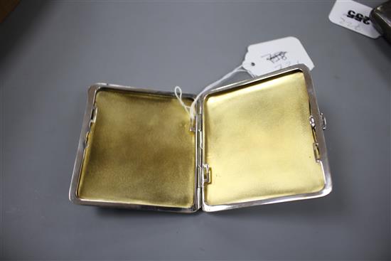 A Continental silver plated cigarette case, c.1900, the lid enamelled with naked female figure in front of a mirror, gilt interior, 8.5